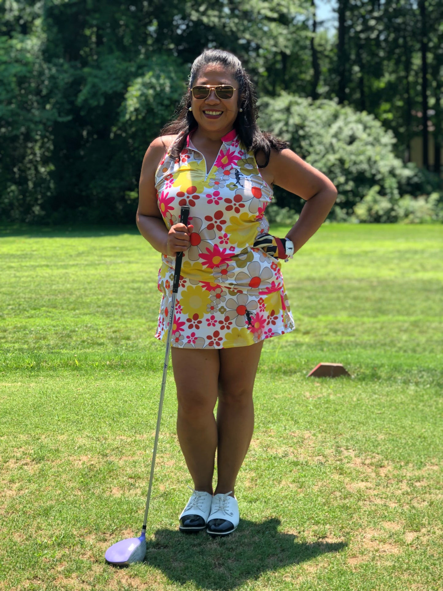the Goldie Women's Golf Sleeveless Zip Polo